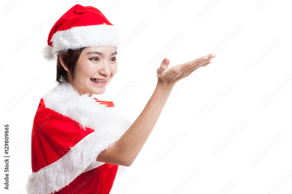 Asian Christmas Santa Claus girl present space on her hand. Asian Christmas Santa Claus girl present space on her hand.