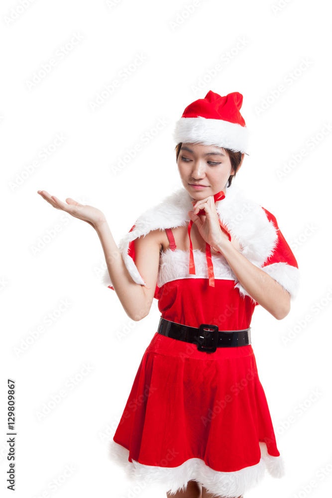 Asian Christmas Santa Claus girl present space on her hand. Asian Christmas Santa Claus girl present space on her hand.