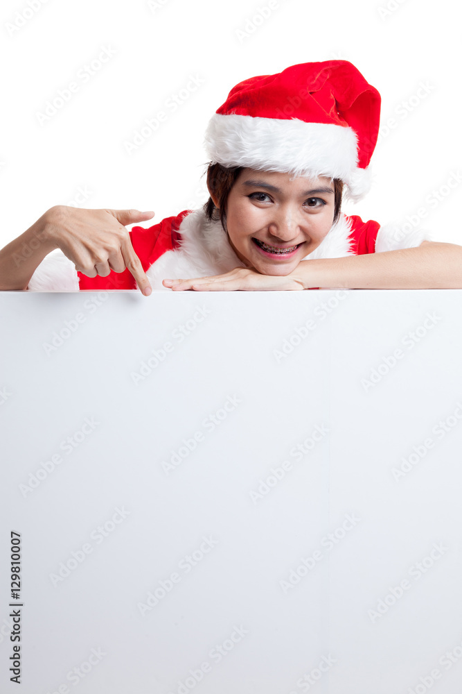 Asian Christmas Santa Claus girl point down to blank sign. Asian Christmas Santa Claus girl point down to blank sign.