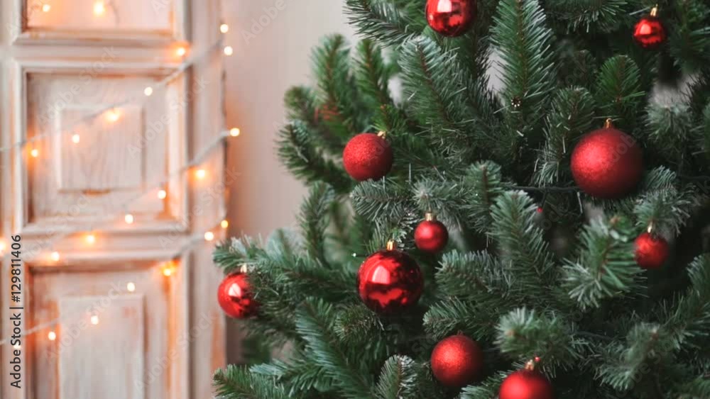 Cristmas tree with red toys on lights background Cristmas tree with red toys on lights background