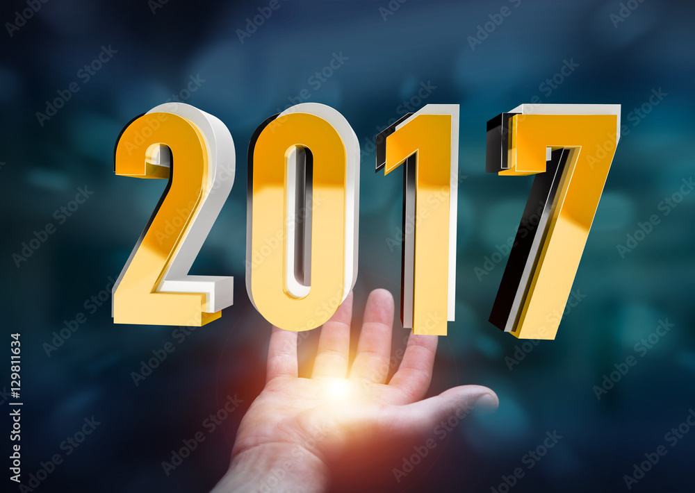 Businessman holding 2017 3D rendering text Businessman holding 2017 3D rendering text