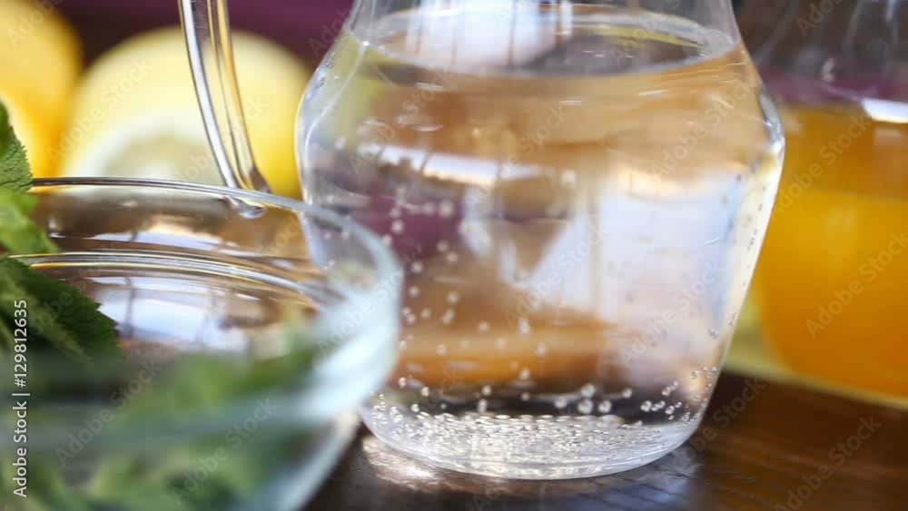 glass bowls with ice cubes and mint leaves for preparing juice glass bowls with ice cubes and mint leaves for preparing juice