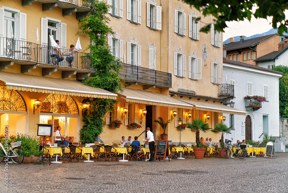 People relaxing at Street Restaurant in Ascona in Swiss canton Ticino