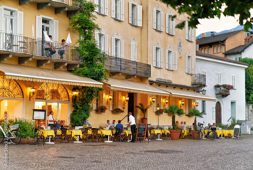 People relaxing at Street Restaurant in Ascona in Swiss canton Ticino photo