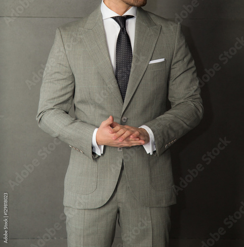 Male model in a grey suit posing