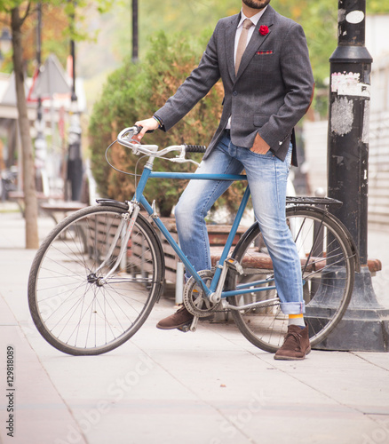 Male model in a torso jacket riding a bike