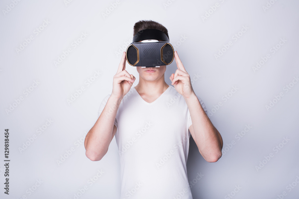 Young man trying vr goggles Young man trying vr goggles
