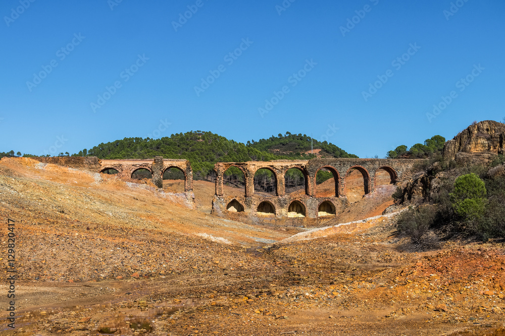 Old bridge in antique exploitation of copper mine in village Sotiel Coronada in  Huelva, Andalusia, Spain
