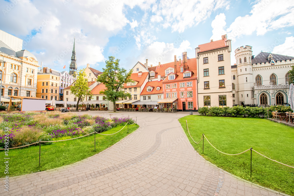 Livu square with beautiful flowerbed and buildings in the old town of Riga, Latvia