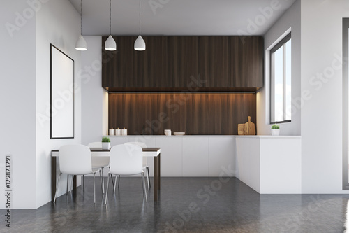 Kitchen with dark wood furniture and poster