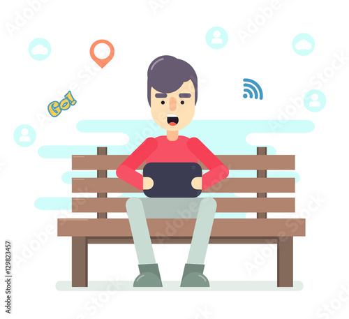 Young Man Sitting In The Park On The Bench With Tablet In Hands Playing Computer Games Social Networking And Texting To Friends Hipster Modern Flat Style Design Elements Cute Cartoon Character Stock