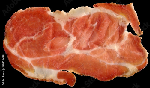 Close-up of Dry Cured Pork Neck Slice Isolated on Black Background