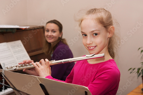 girl, teacher and flute, piano