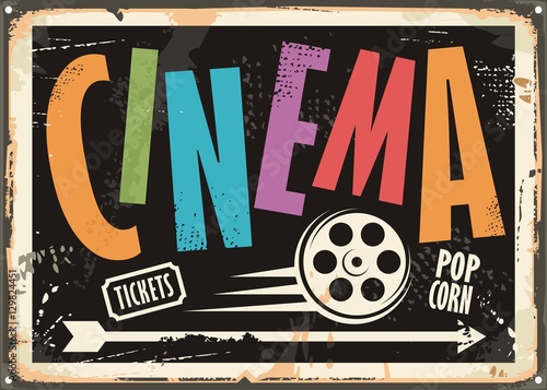 Cinema vintage signboard design concept with colorful text and film roll on black background