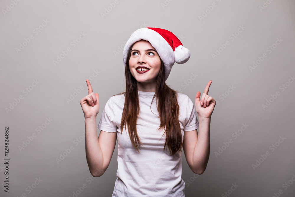 Beautiful female model wear santa hat pointed up Beautiful female model wear santa hat pointed up