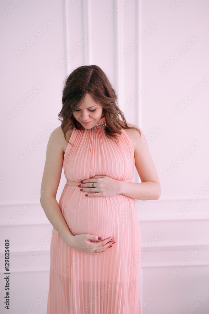 Happy pregnant young woman waiting for a child Happy pregnant young woman waiting for a child