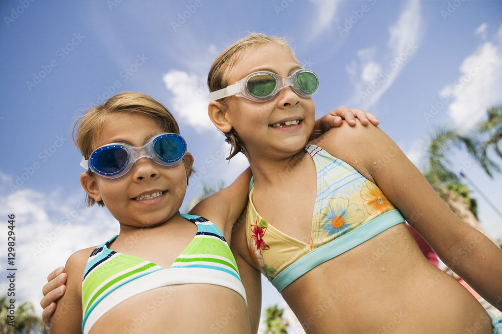 Two Girls (7-9) in swimwear portrait. Two Girls (7-9) in swimwear portrait.