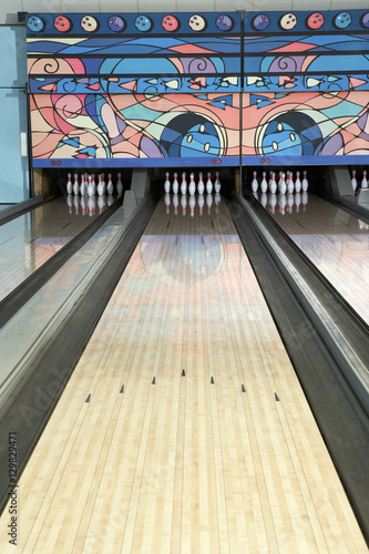 Lane of a bowling alley game with tenpins photo