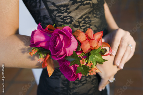 Fotografering Teenage girl wearing corsage close-up of flowers