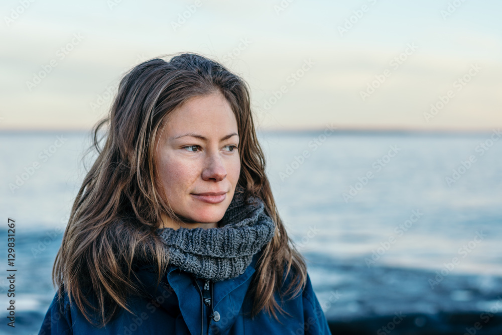 young woman portrait at the beach with hair down