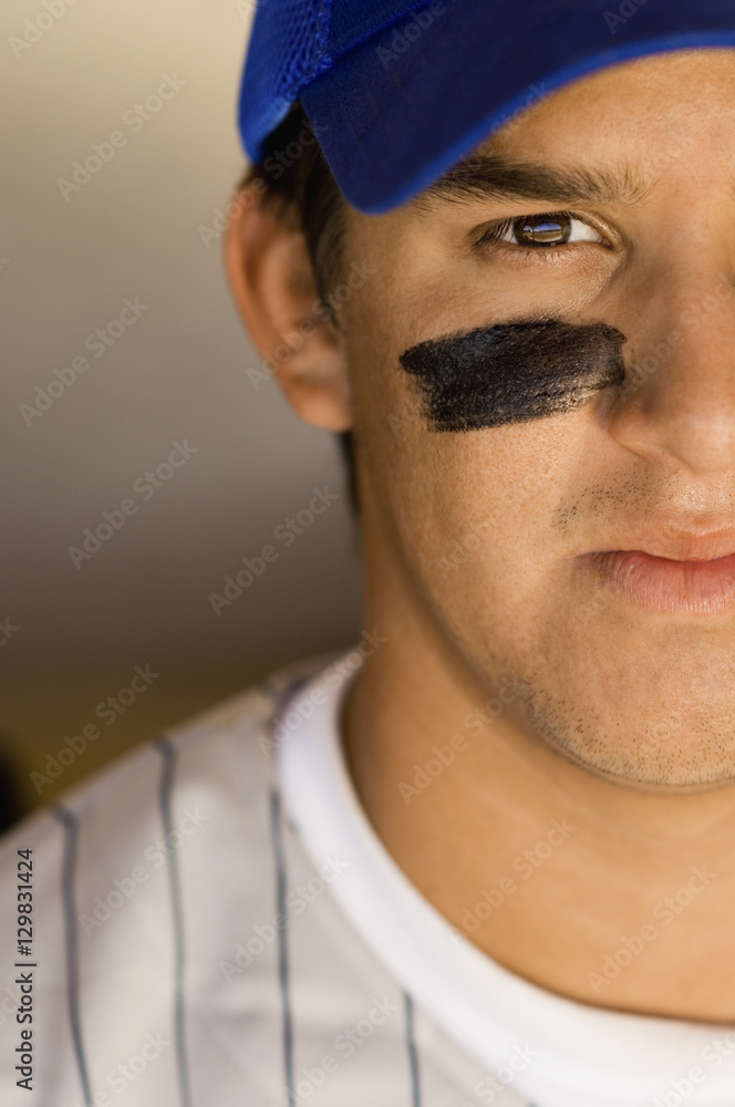 Closeup of a cropped confident baseball player Closeup of a cropped confident baseball player
