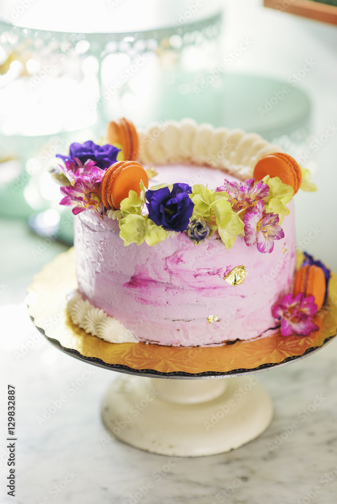 Sweden, Vasterbotten, Umea, Pink cake on cake stand Sweden, Vasterbotten, Umea, Pink cake on cake stand