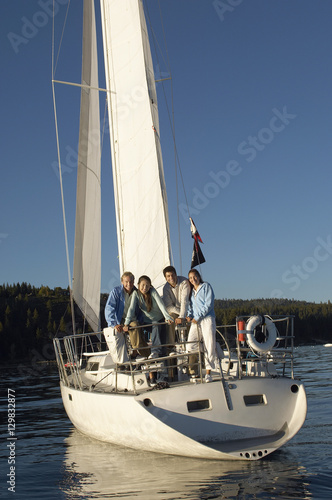 Multiethnic group of friends on sailboat