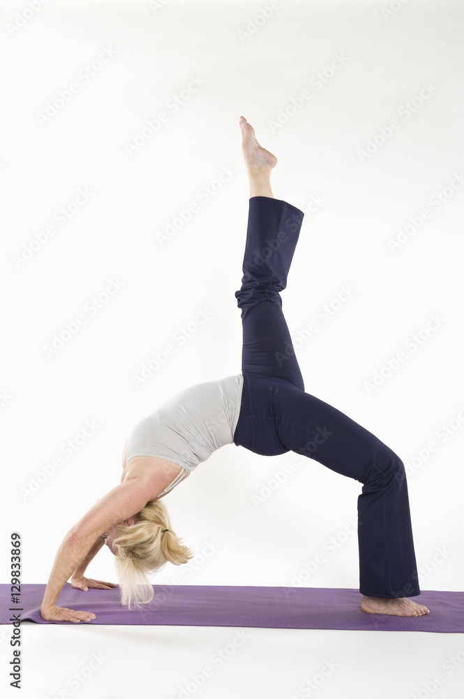Woman bending her back and stretching her leg Woman bending her back and stretching her leg