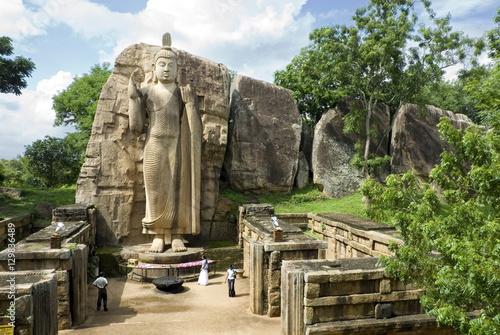 Statue of Buddha, 12 metres tall, carved in granite, Aukana, north of Dambulla, Sri Lanka photo
