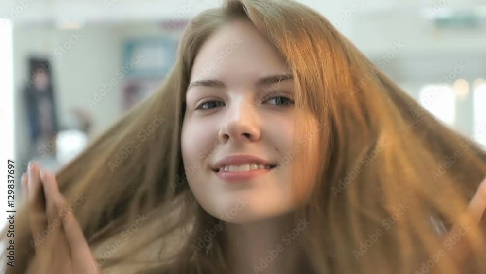 Brown-haired without make up smiling on the camera. Close-up Brown-haired without make up smiling on the camera. Close-up