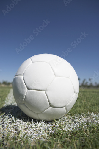 Closeup of a soccer ball on corner of field © moodboard