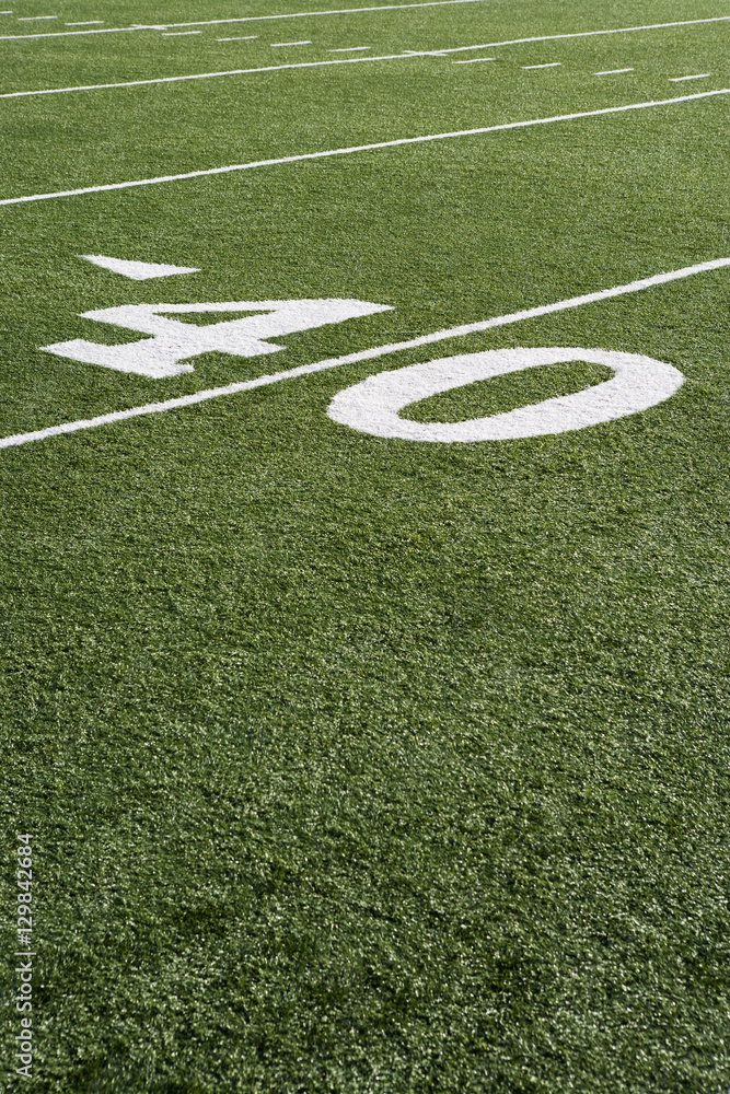 40 yard line on American football field with artificial turf