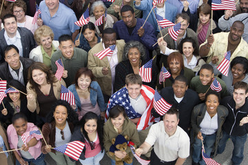 High angle view of people raising American flags