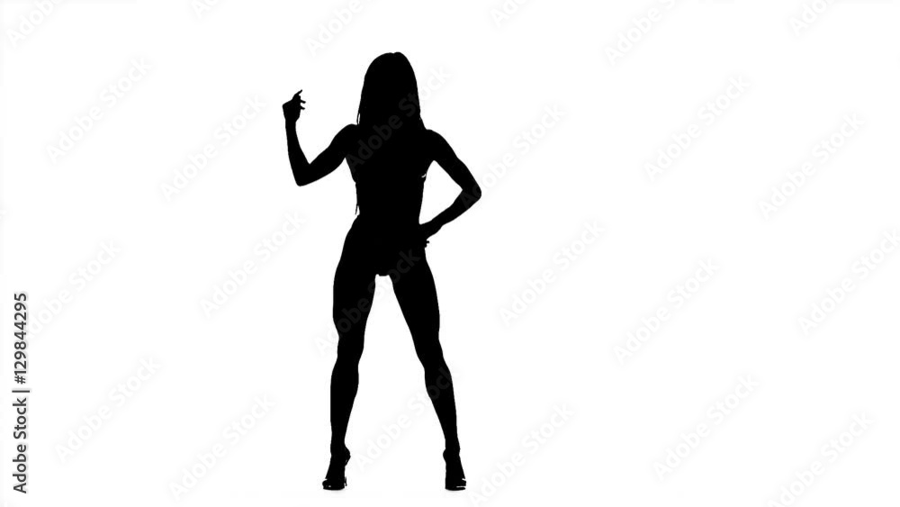 Silhouette bodybuilding girl posing on white background in black and white. Slow motion. Silhouette bodybuilding girl posing on white background in black and white. Slow motion.