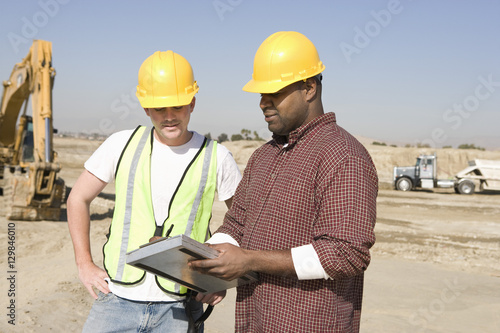 Foreman informing work to worker at construction site