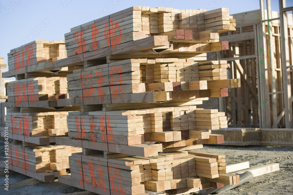 Stacked of wooden planks at construction site Stacked of wooden planks at construction site