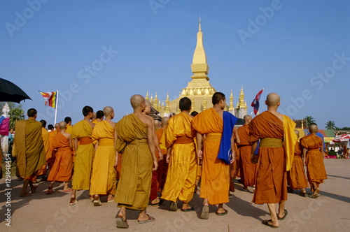 A group of monks at the annual Makka Bu Saa Buddhist celebration, during Pha That Luang (Buddhist Lent), in Vientiane, Laos photo