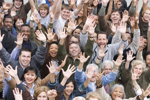 High angle view of group of happy multiethnic people raising hands together