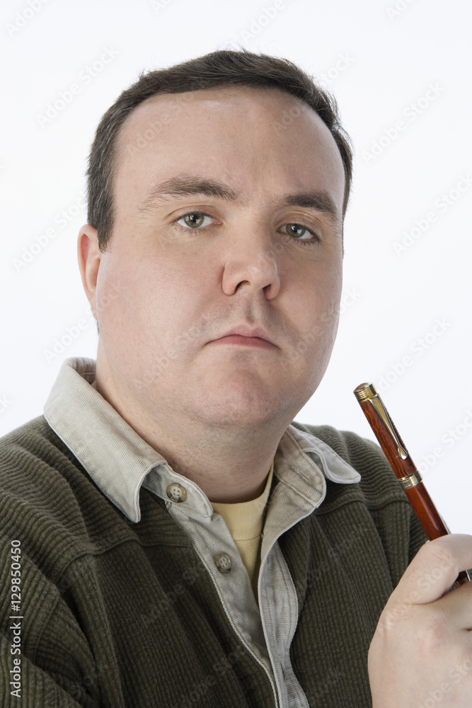 Portrait of middle aged man holding pen isolated over white background Portrait of middle aged man holding pen isolated over white background