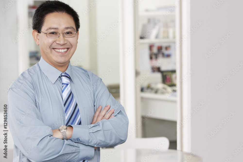 Portrait of a happy mature businessman with arms crossed Portrait of a happy mature businessman with arms crossed