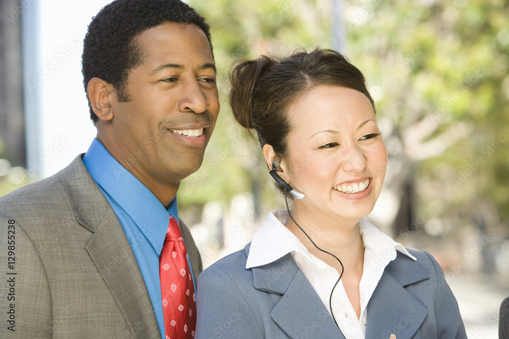 Multiethnic business people smiling together Multiethnic business people smiling together