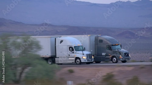 CLOSE UP: Freight semi truck driving and transporting goods on busy highway