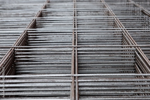 metal rods stacked in piles