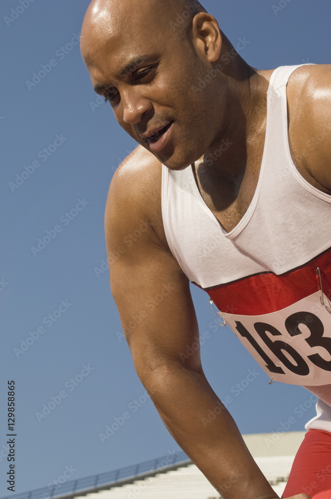 African American male athlete against clear sky African American male athlete against clear sky