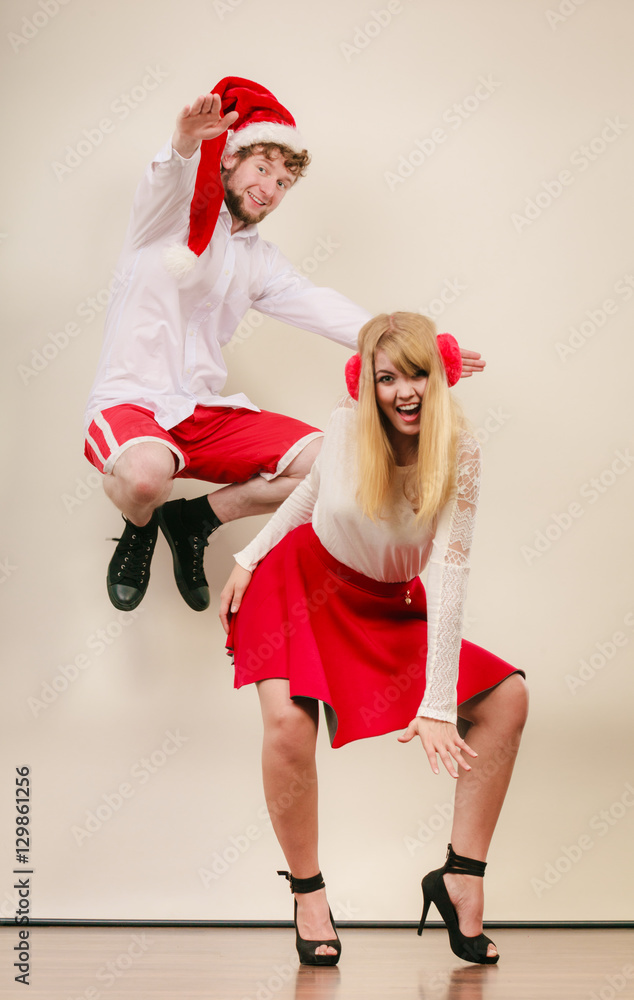 Obraz premium Happy active couple dancing and jumping.