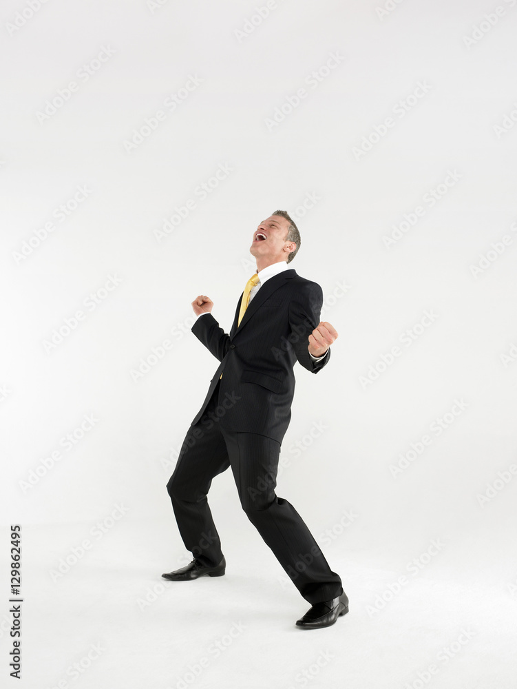 Full length portrait of a cheerful business celebrating against white background Full length portrait of a cheerful business celebrating against white background