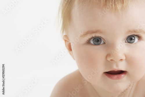 Closeup portrait of cute baby isolated on white background