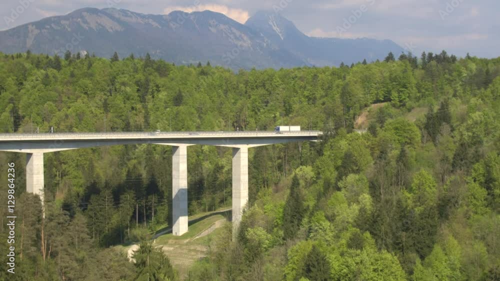 AERIAL: Big highway viaduct leading into the tunnel under the mountain AERIAL: Big highway viaduct leading into the tunnel under the mountain