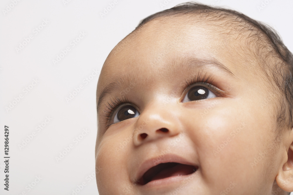 Closeup of smiling baby boy isolated on white background Closeup of smiling baby boy isolated on white background