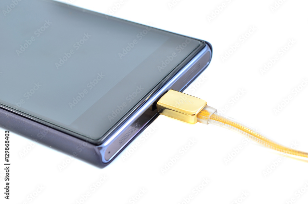 Smartphone with high speed gold usb cable isolated on white background Smartphone with high speed gold usb cable isolated on white background